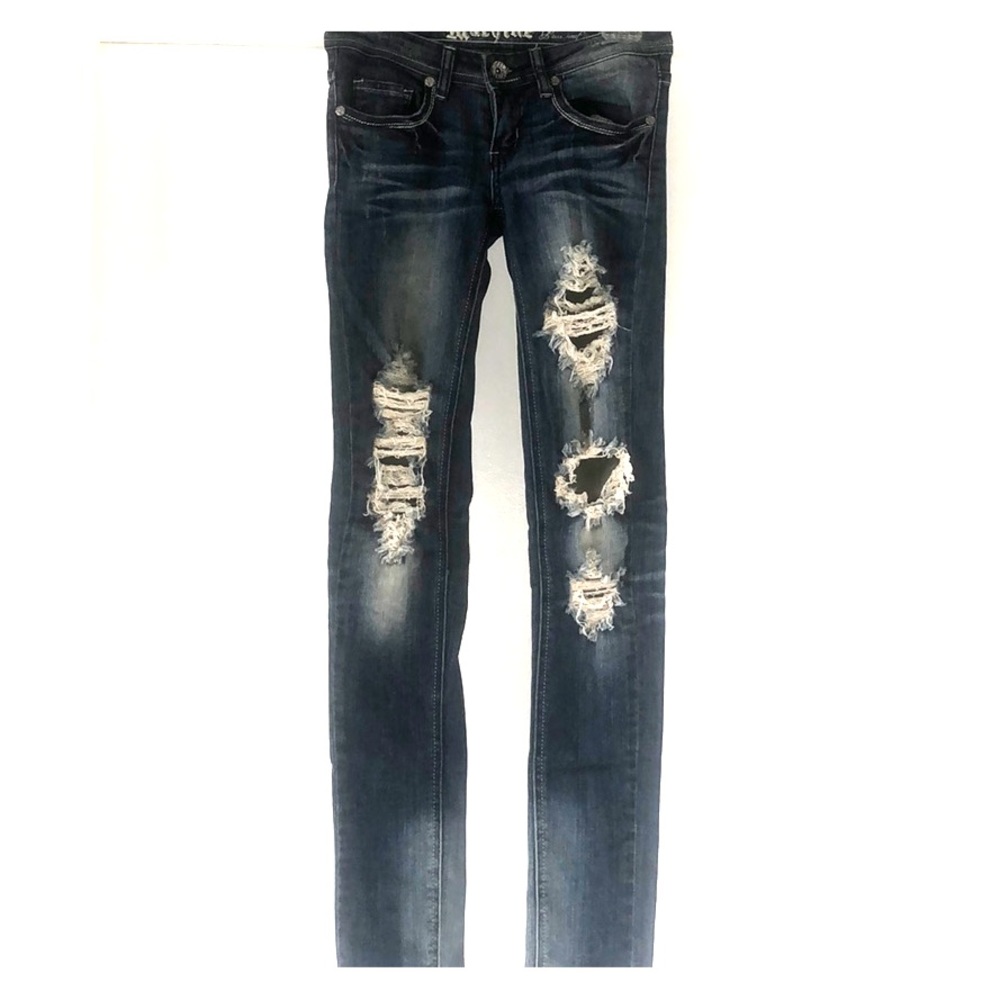 Distressed skinny machine jeans